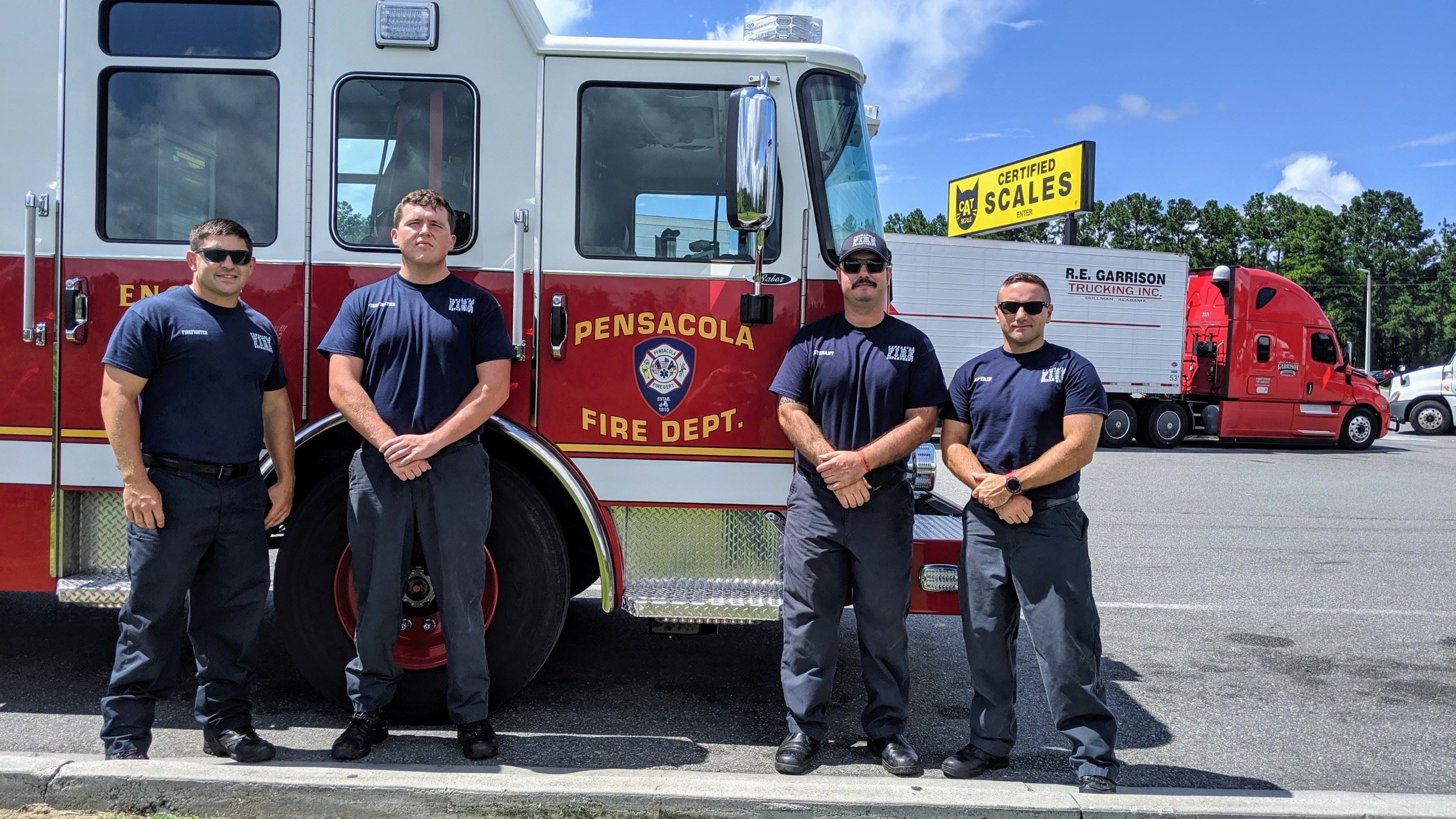 Firefighters in front of a fire truck