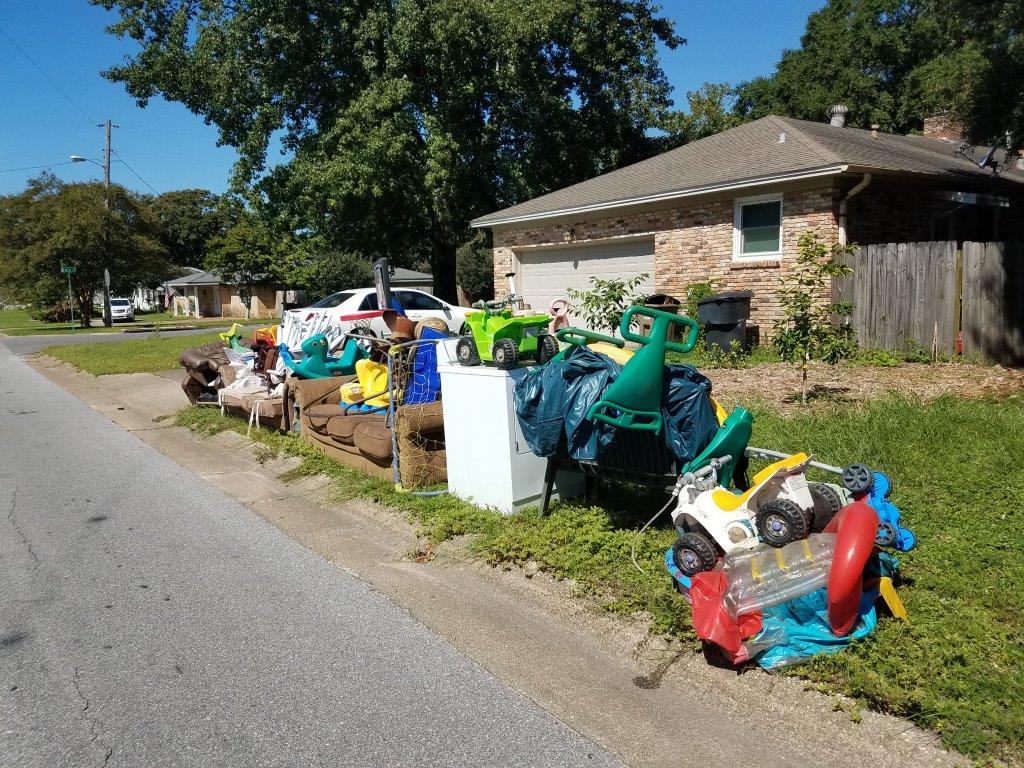 Toys and furniture left at the curbside for pickup by City of Pensacola Sanitation
