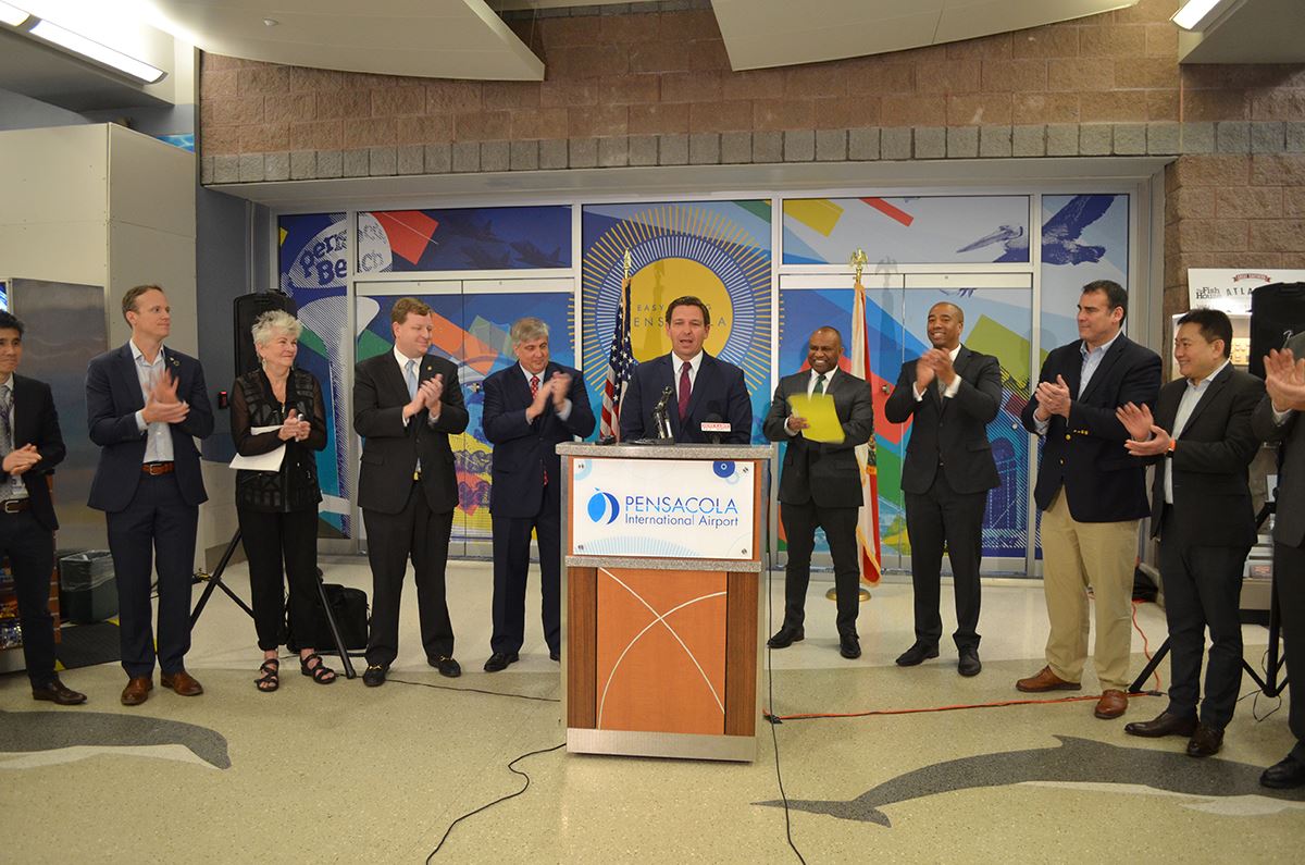 Gov. Ron DeSantis makes an announcement at Pensacola International Airport