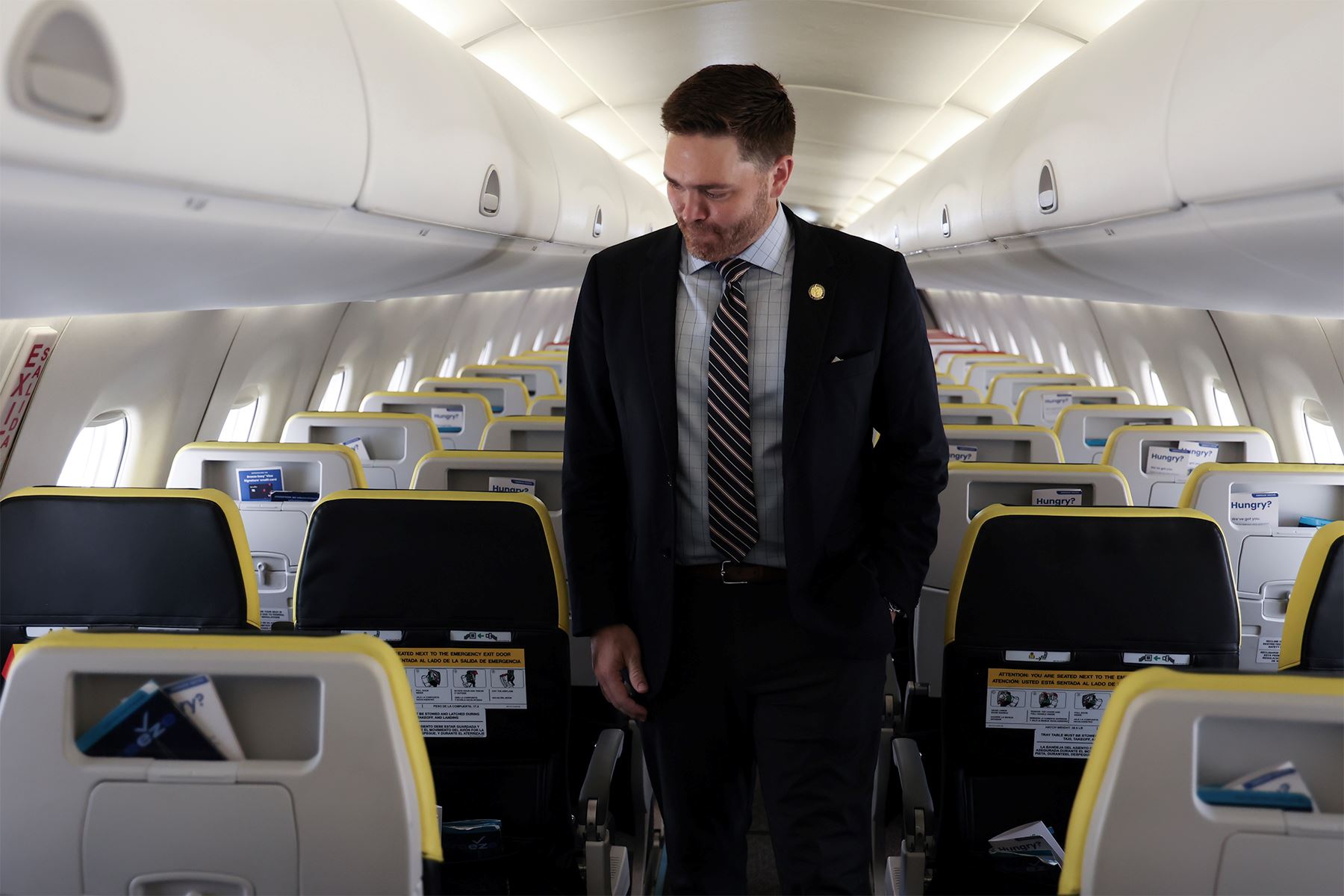 Mayor Reeves walks down aisle of Breeze Airways plane