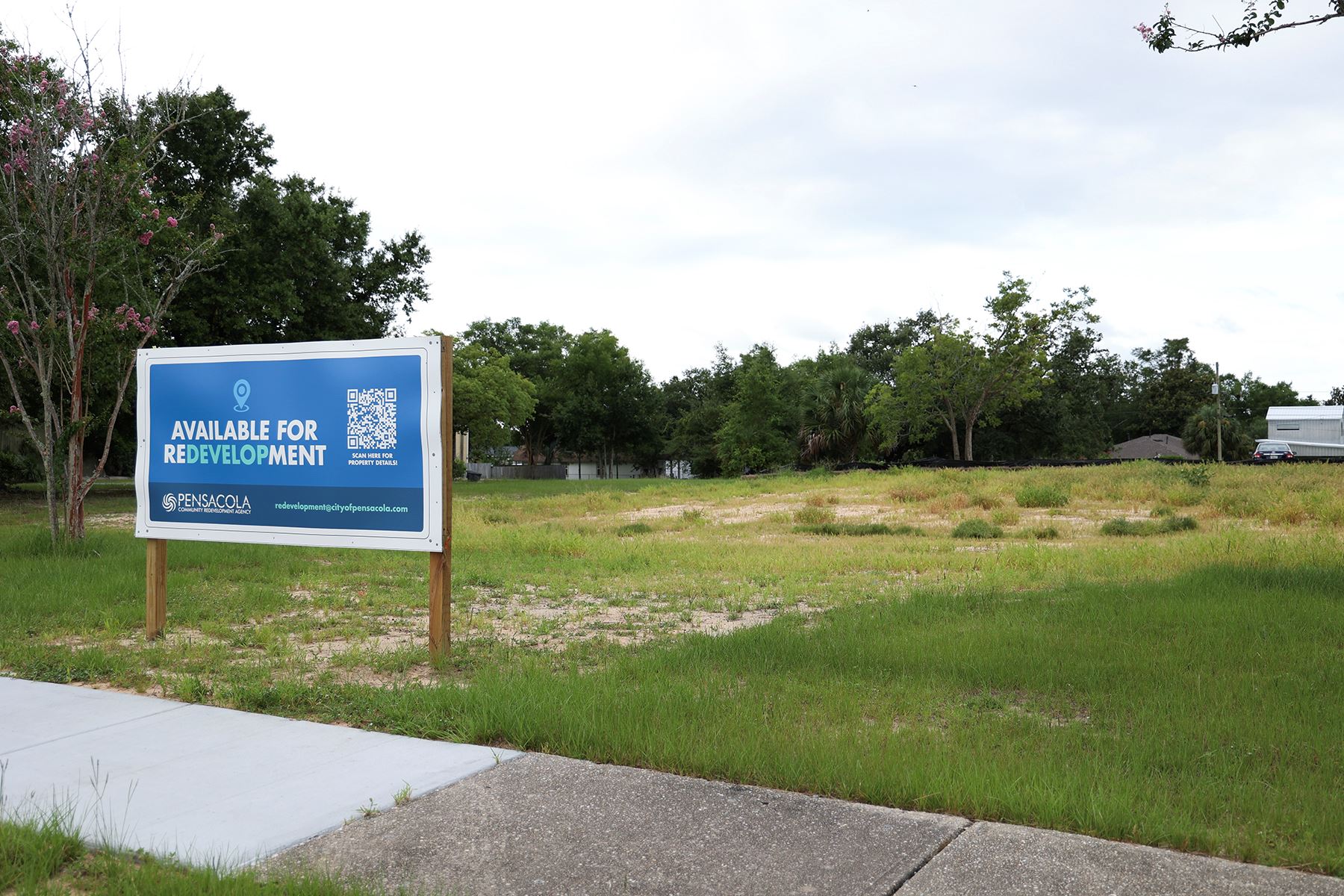 Empty lot with sign in front