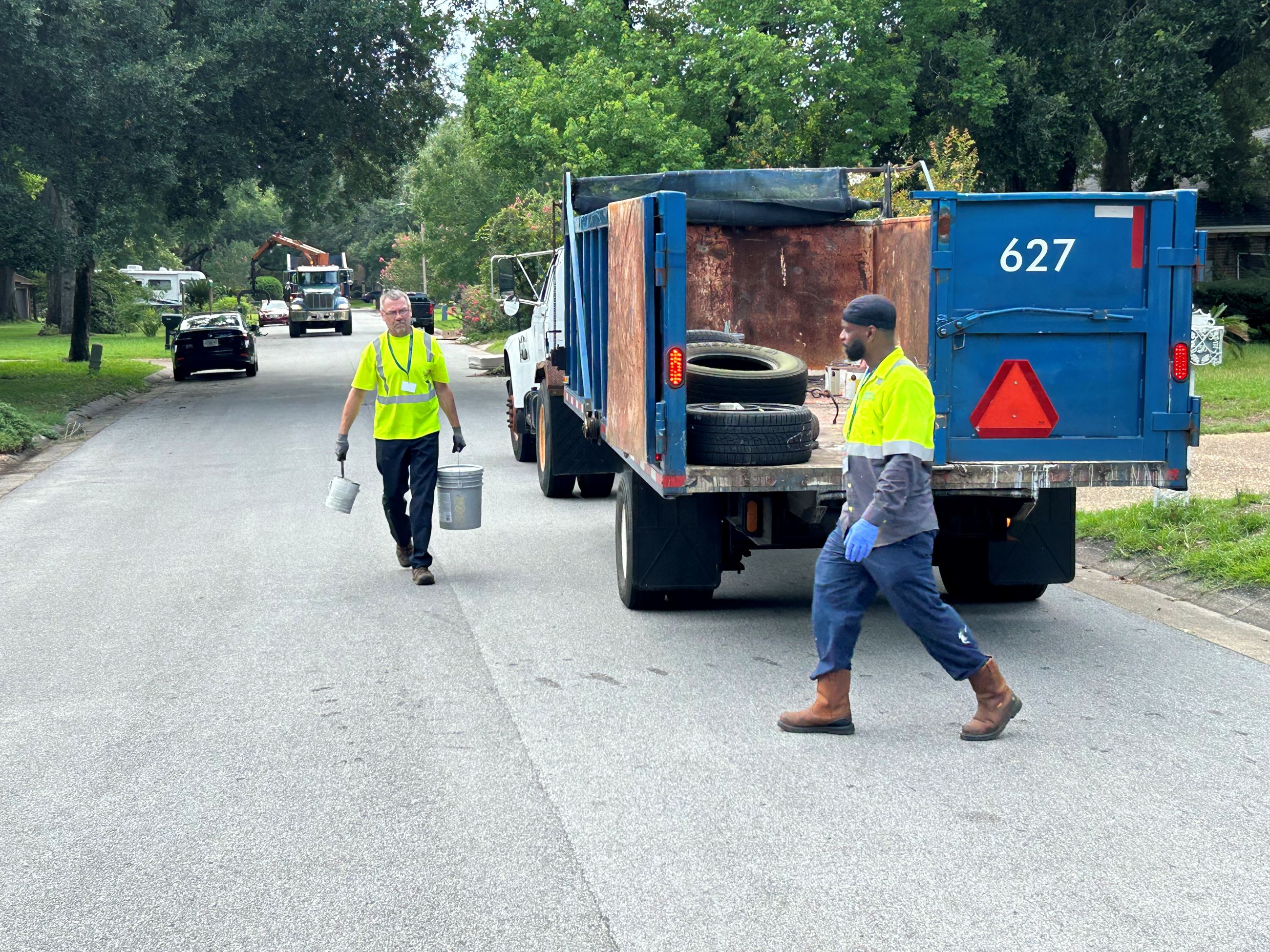 City Sanitation crew collecting bulk items from the July Neighborhood Cleanup.
