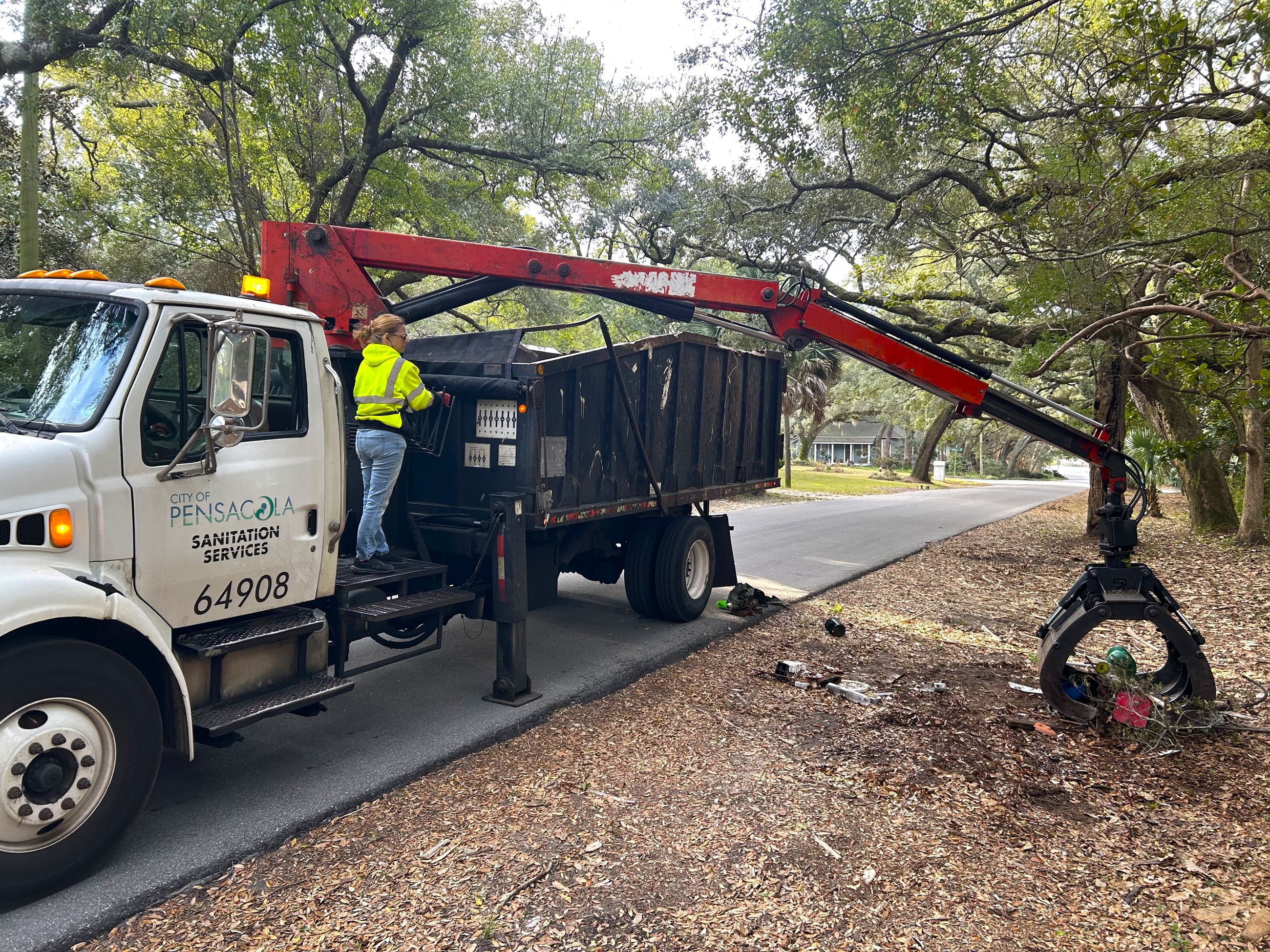 City of Pensacola Sanitation Services worker collecting items for the Mayor's Neighborhood Cleanu